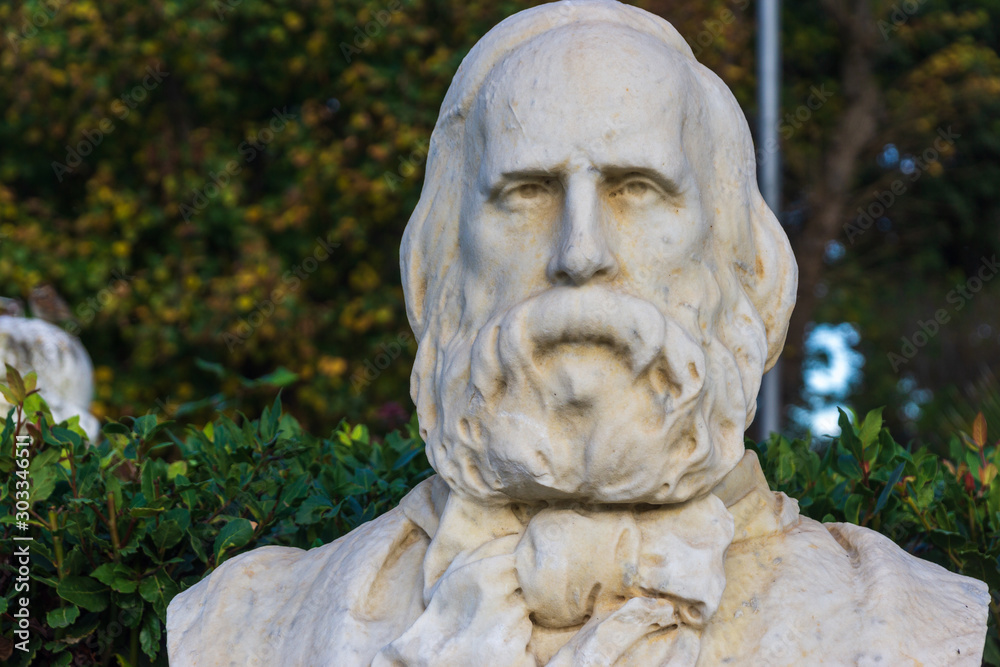 Old marble bust of Giuseppe Garibaldi in the public park Pincian Hill, Villa Borghese gardens, Rome, Italy