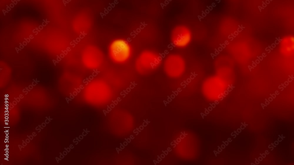 Christmas red background. Twinkle lights. Defocused golden glowing circles overlay. Christmas red background. Twinkle lights. Defocused golden glowing circles overlay.