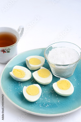 sliced boiled eggs with salt