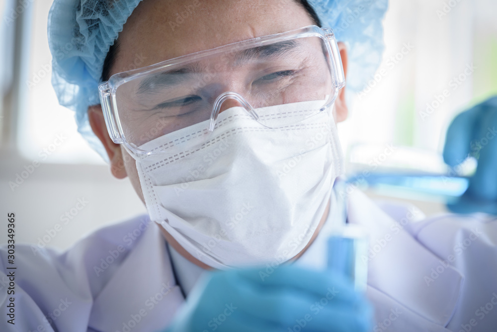 Asian man scientist researching and learning in a laboratory. Asian man scientist researching and learning in a laboratory.