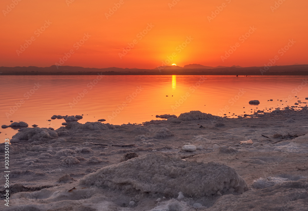 Beautiful and bucolic sunset landscape, in the salt lagoon of the natural park of las salinas, in Torrevieja,Alicante,Valencia, Spain