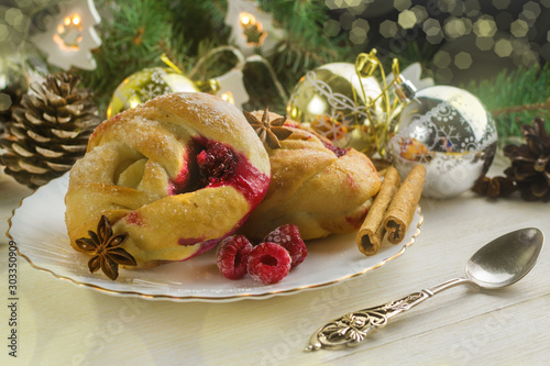 Christmas buns with fruit raspberry jam. Festive pastries with spices photo