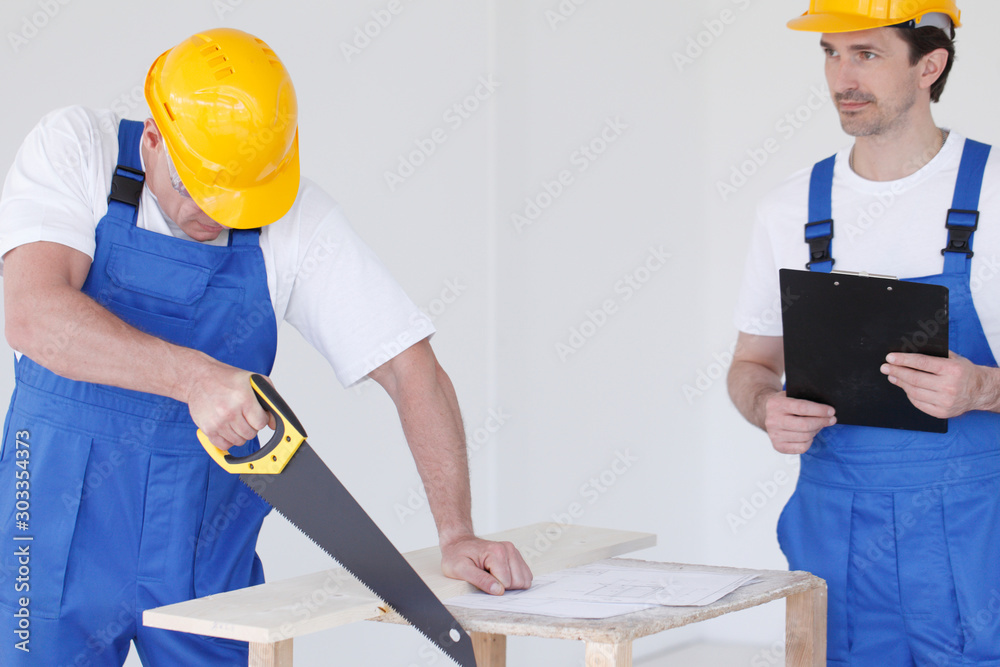 Two workmen at construction site Two workmen at construction site