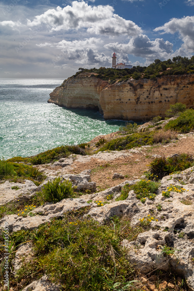 Farol de Alfanzina, a lighthouse near Carvoeiro at the southern coast of the Algarve, Portugal.