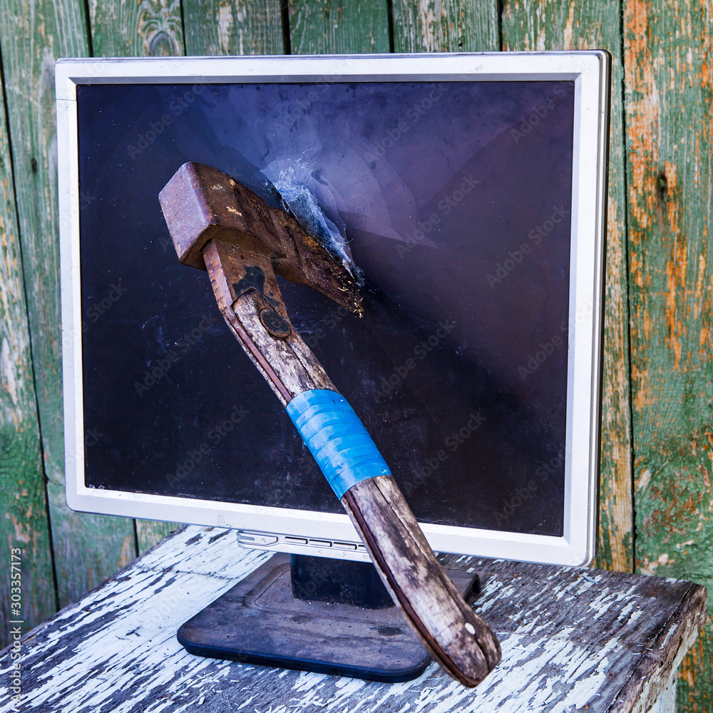 Axe in the Computer Monitor foto de Stock | Adobe Stock