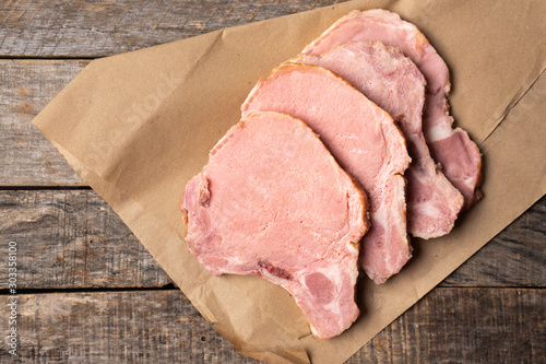 Smoked pork chops on wooden background