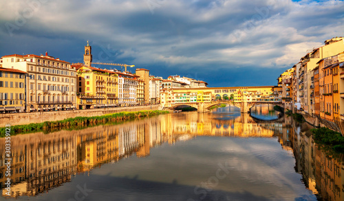 View of medieval stone bridge Ponte Vecchio over Arno river in Florence, Tuscany, Italy. Beautiful Florence after the rain. Florence architecture and landmark. © Vladimir Sazonov