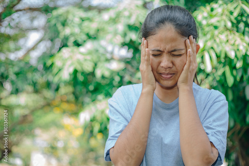 Young Woman Suffering From Painful Feeling headache , Healthcare Concept