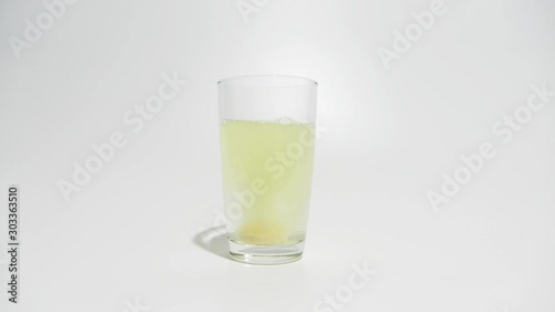 The effervescent tablet dissolves in water