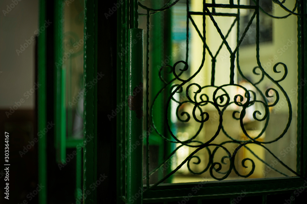 Close-up curved steel door inside old building Close-up curved steel door inside old building