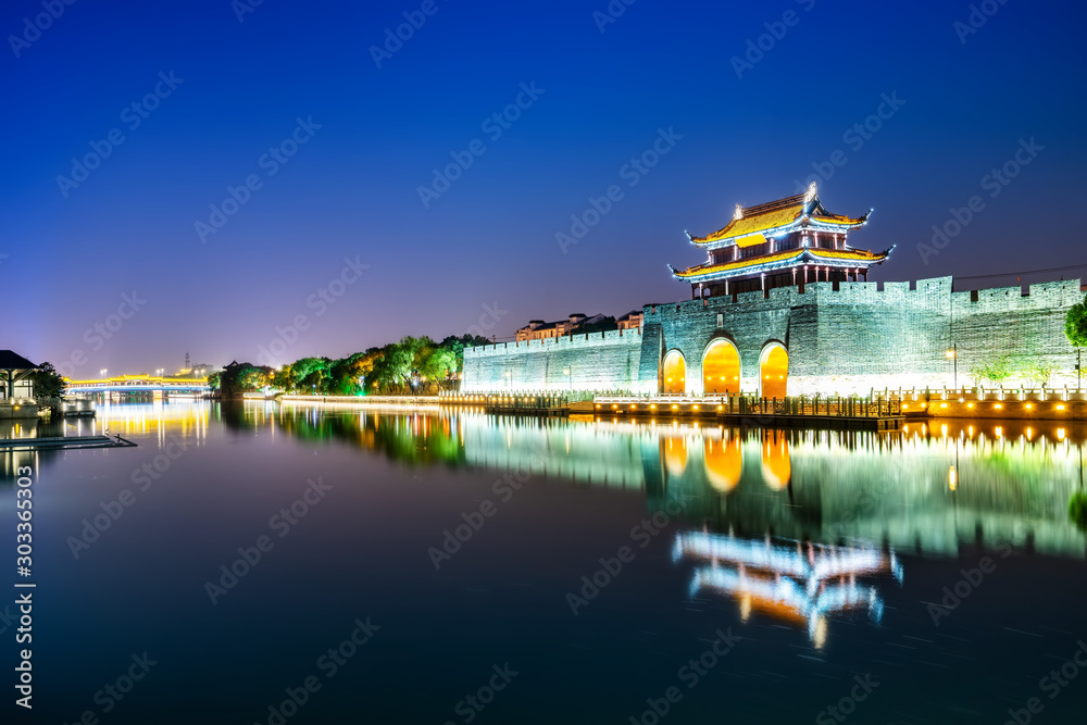 Fototapeta premium Night view of ancient city wall of pingmen, Suzhou..