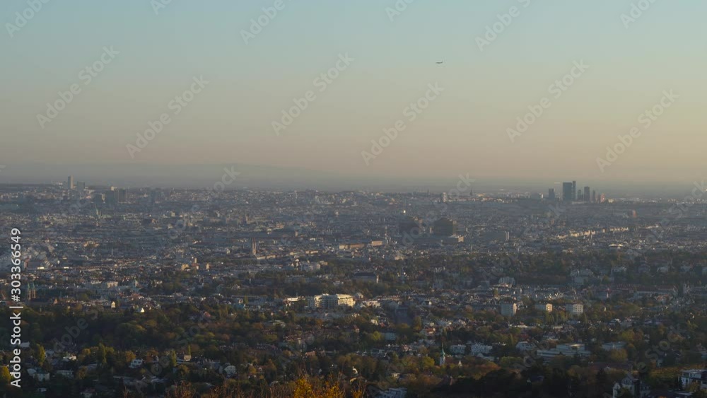 visible airplane flying over vienna skyline, wide angle still shot visible airplane flying over vienna skyline, wide angle still shot