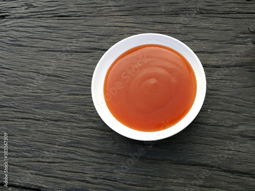 Tomatoes sauce​ on wood background 
