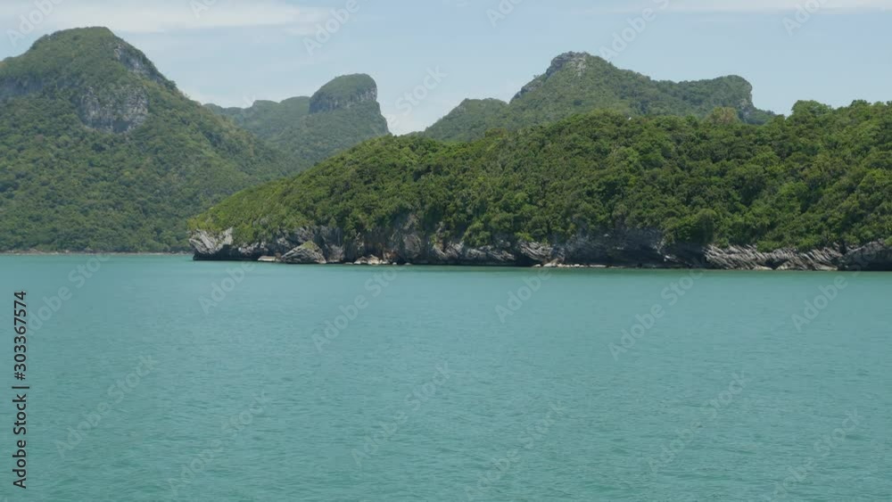 Group of Islands in ocean at Ang Thong National Marine Park near touristic Samui paradise tropical resort. Archipelago in the Gulf of Thailand. Idyllic turquoise sea natural background, copy space Group of Islands in ocean at Ang Thong National Marine Park near touristic Samui paradise tropical resort. Archipelago in the Gulf of Thailand. Idyllic turquoise sea natural background, copy space
