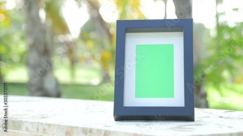 Picture frame with greenscreen product shot with tropical background