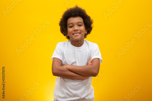 Cuadro en lienzo African American boy with black power hair on yellow background