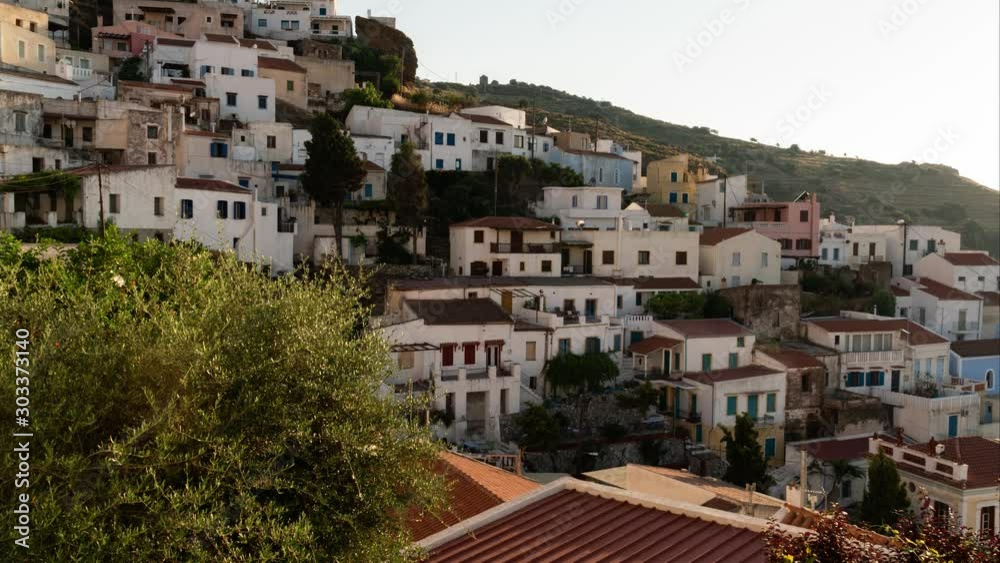 white scene of hillside houses of kea from day to night, push in time lapse shot white scene of hillside houses of kea from day to night, push in time lapse shot