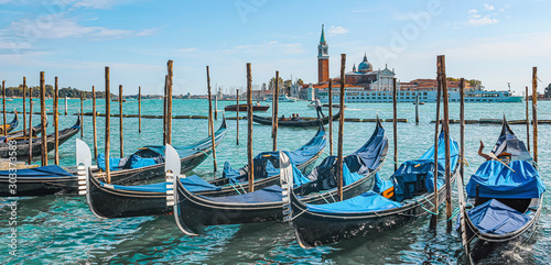 Gondolas  at the pier in Grand Canal , San Giorgio Maggiore background, Venice, Italy © elpo11o