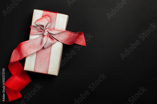 gift box on a black background, blank for postcard, poster, banner, place for your text