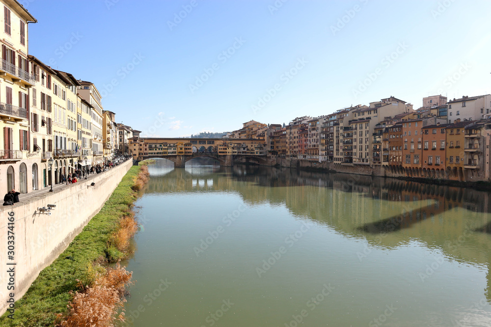 Panoramic view to river Arno and famous landmark ponte vecchio in florence in clear winter day