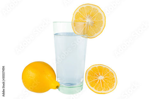 Lemon with a glass of water on a white background.