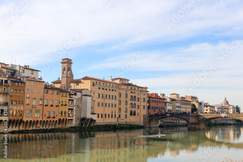 View to embankment of Arno river with bridge and medieval buildings, Florence, Italy