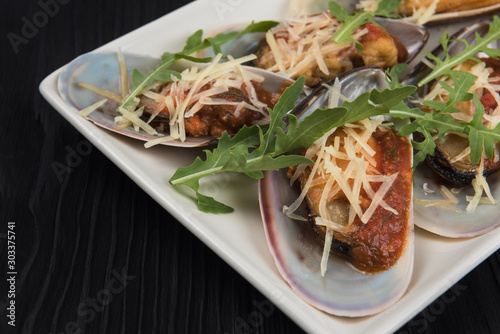 Cooked mussels with sauce c...