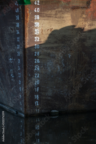 details of the harbor - haven little secrets - numbers, boats, deepth signs photo