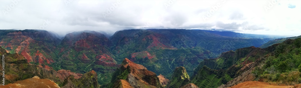 Panoramic waimea canyon kauai hawaii landscape with mountains and clouds