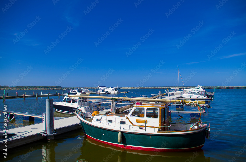 Harbor, boats on blue water, ready for fun on the water, fast boats for free people. Vacation with family or wild weekend with friends.