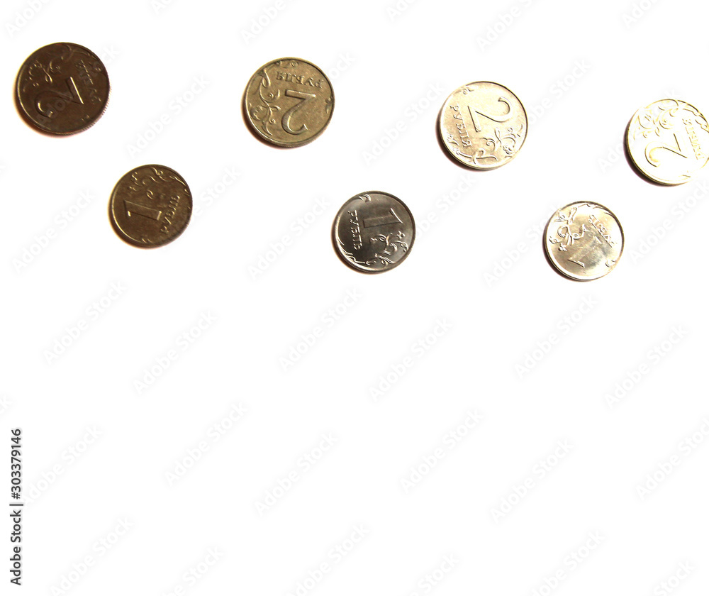 Several Russian coins lie on a white isolated background at the top. Shiny Russian metal money. Place for text. Several Russian coins lie on a white isolated background at the top. Shiny Russian metal money. Place for text.