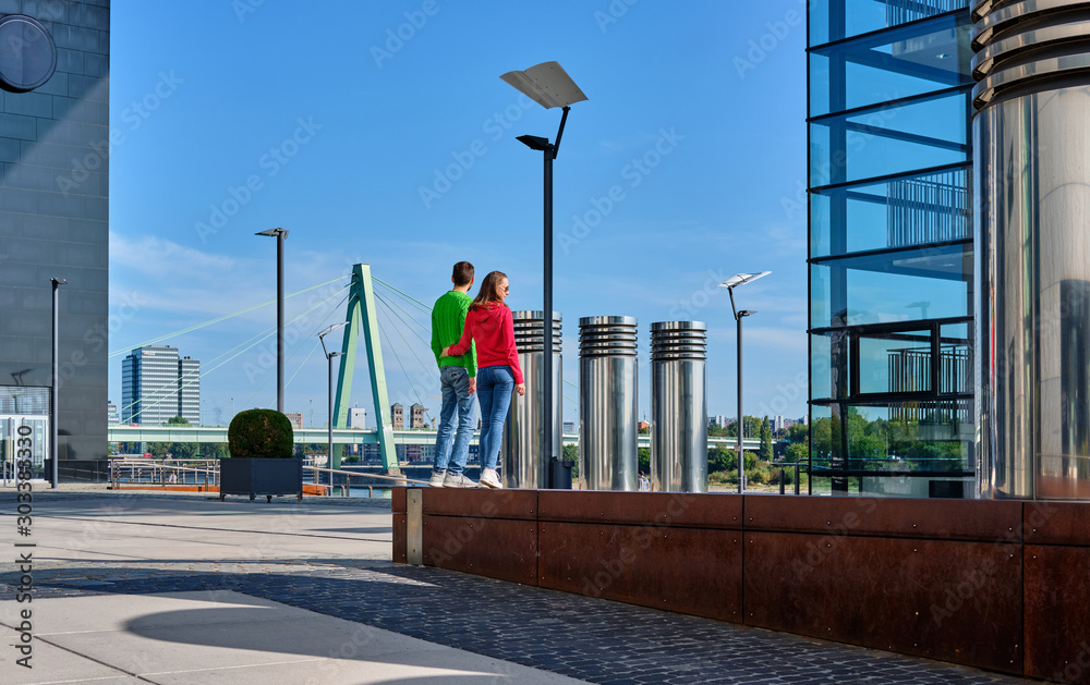 Φωτογραφία Tourists in Cologne near Kranhaus building complex with crane house on riverside of Rhein in Cologne, Germany