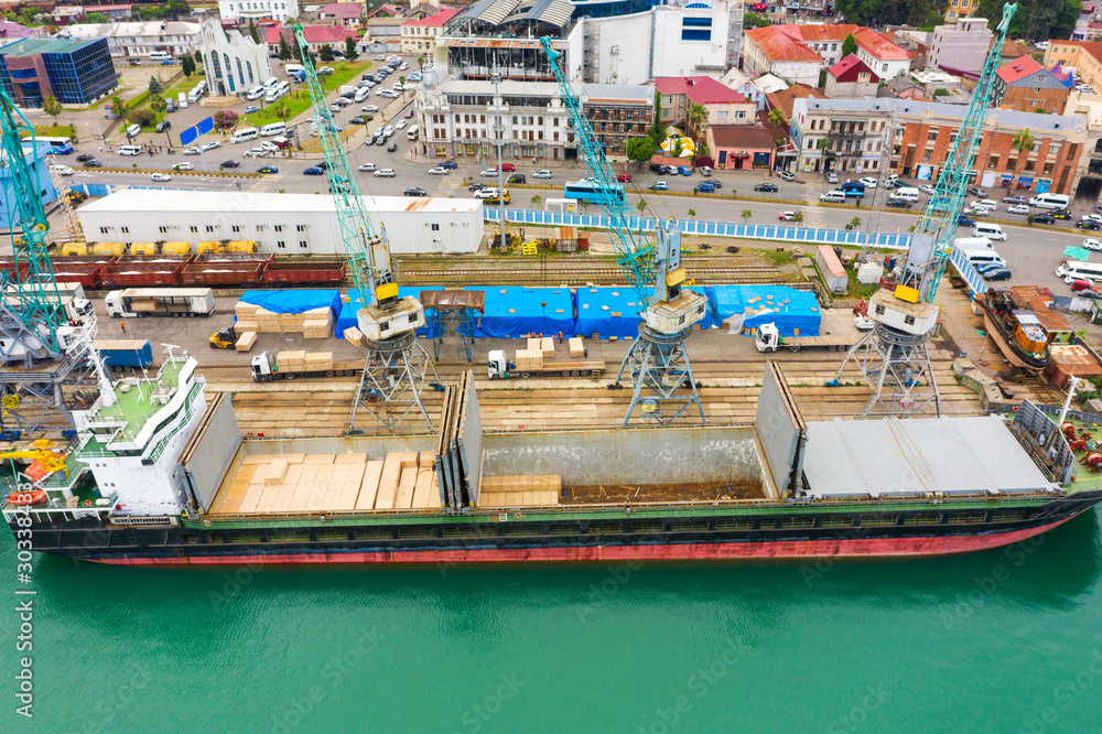 Bulk cargo ship under port crane, Batumi seaport, Georgia