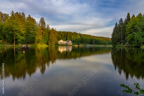 Fototapeta Naklejka Na Ścianę i Meble -  Ebnisee Lake Long exposure Forest Landscape House