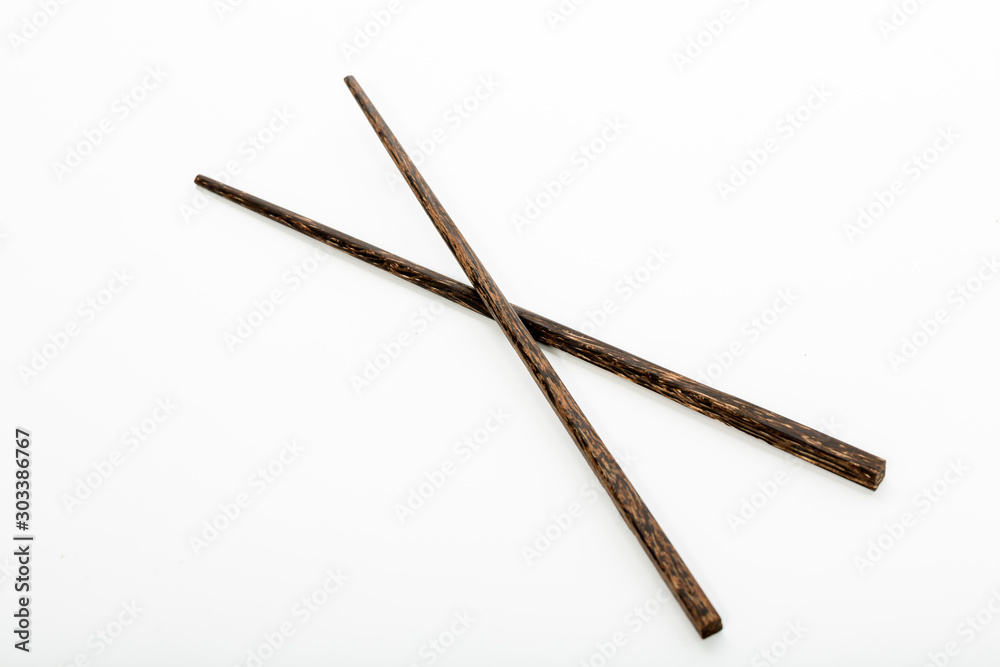 Wooden chop sticks on white background Wooden chop sticks on white background