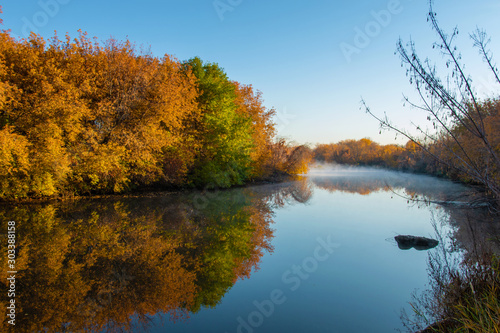 autumn landscape by the river in the morning
