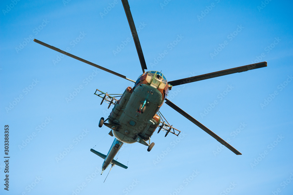 Military helicopter flying during exercise Military helicopter flying during exercise