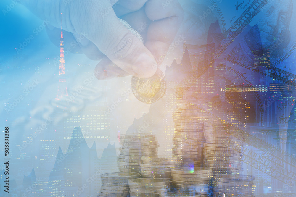 Double exposure money pile coins on trading graph and capital city background