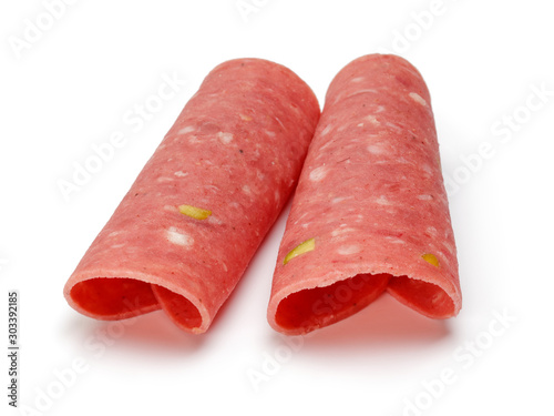 Salami slices with pistachio, isolated on white background