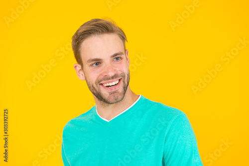 as happy as i wish. just feel the happiness. handsome guy in good mood. male facial care. have perfect look. sexy man beard yellow background. unshaven man express positivity. he has stylish bristle © be free