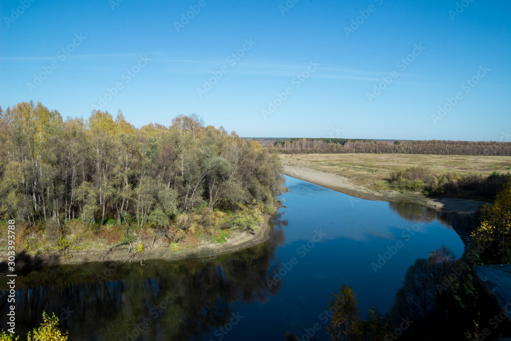 Beautiful river among the forest and ravines. Among the birches and pines.