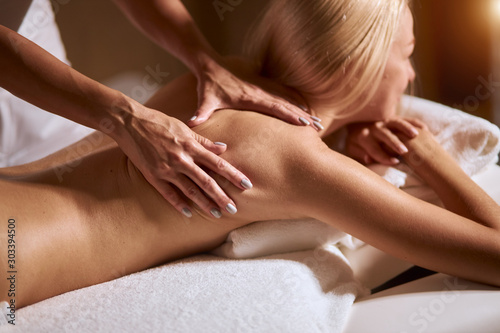 Body care. Spa body massage woman hands treatment. Woman having massage in the spa salon, close up