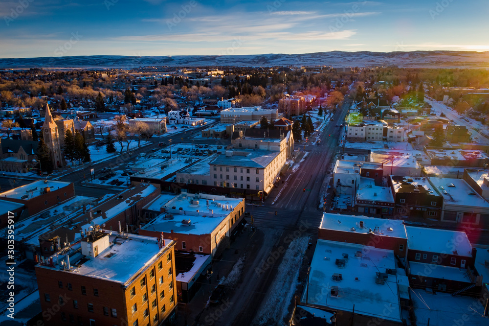 Morning Sunrise Aerial Drone View of Downtown Laramie, Wyoming in the Winter with Fresh Snow