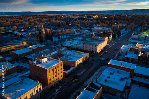 Morning Sunrise Aerial Drone View of Downtown Laramie, Wyoming in the Winter with Fresh Snow