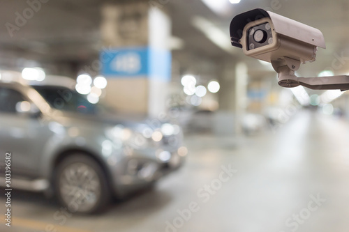 CCTV security camera  on blur car parking