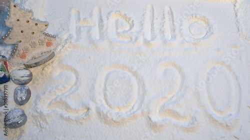 Wallpaper Mural Christmas background with Christmas tree and silver nuts on a white background. The inscription "Hello 2020" Torontodigital.ca