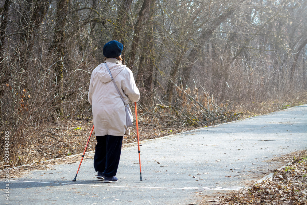 elderly women walk in the autumn park