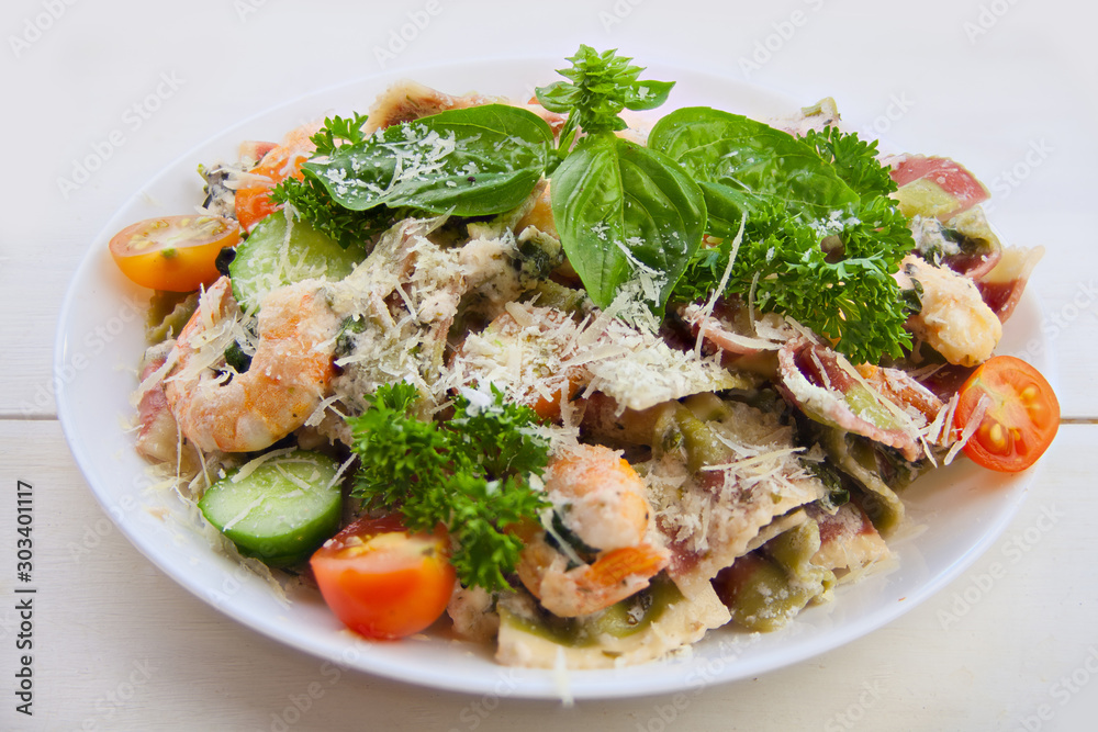 delicious delicious spaghetti with shrimps and basil on plate delicious delicious spaghetti with shrimps and basil on plate