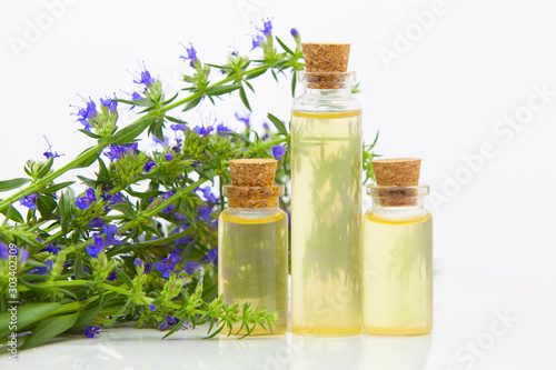 hyssop essential oil in  beautiful bottle on White background