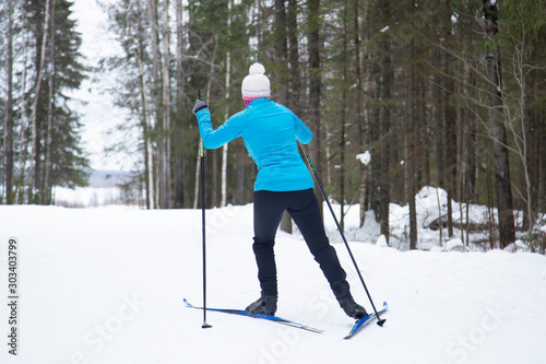 Cross country. A skier is skiing in winter in the woods. © Александр Поташев